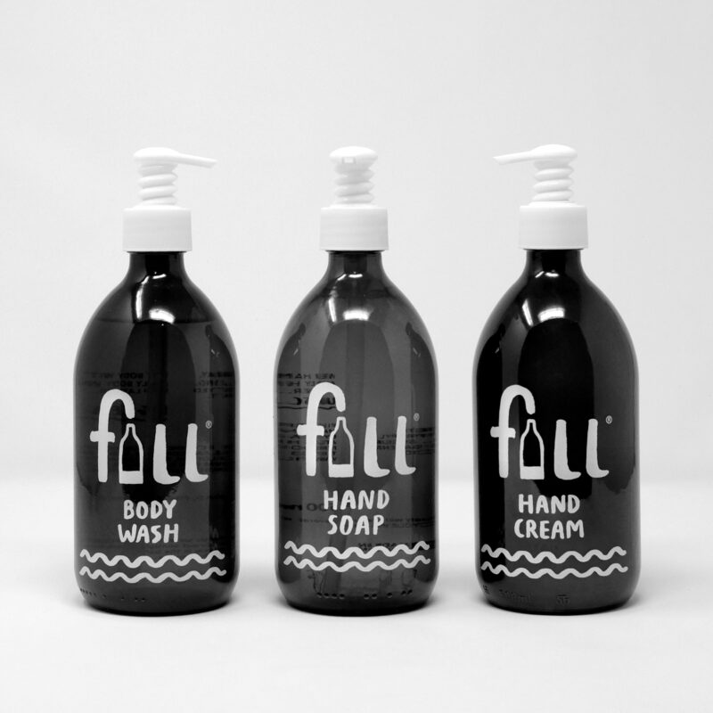 Three glass bottles of Fig Leaf scented products